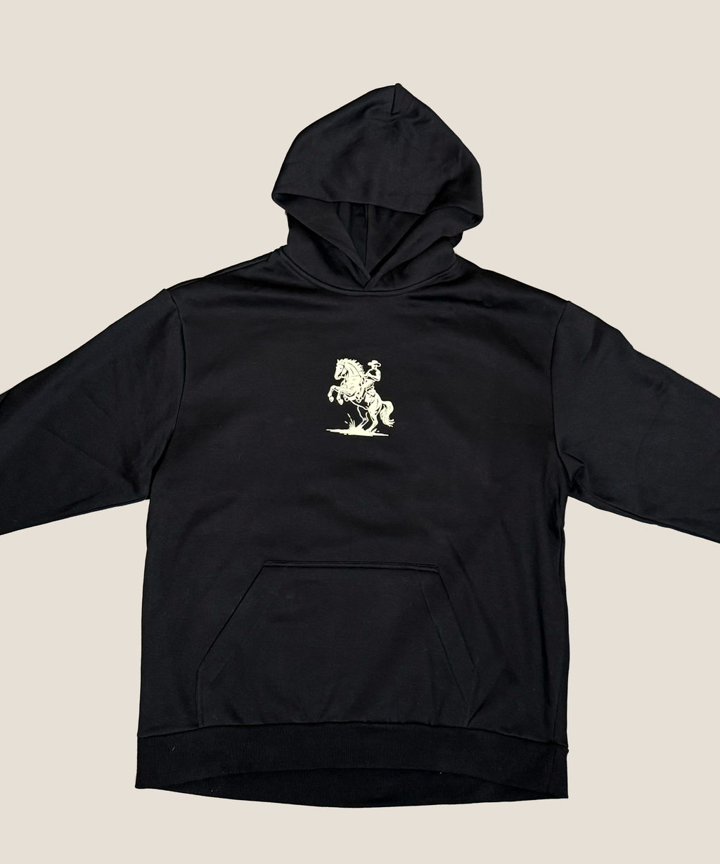 Black hoodie with a white graphic on a beige background