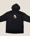 Black hoodie with a white graphic on a beige background